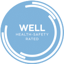 logo for an award from Well, Health and Safety rated in a blue backdrop
