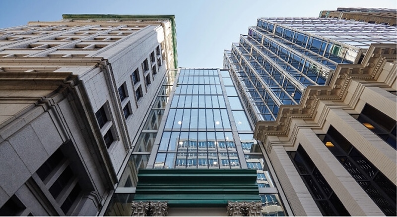 a tall white building filled with pristine and clear windows