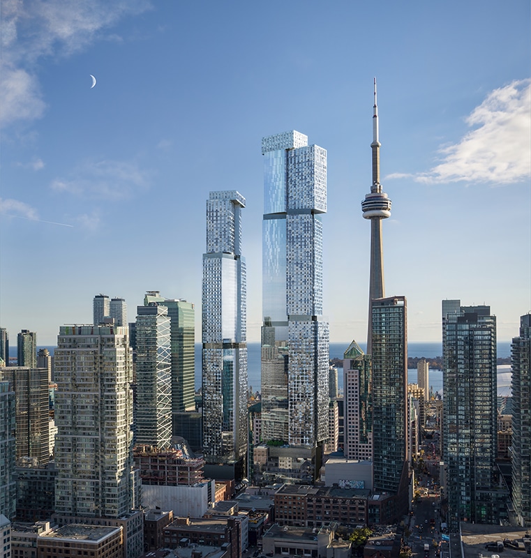 Cityscape featuring the CN Tower surrounded by tall skyscrapers under a clear sky with scattered clouds and a visible crescent moon