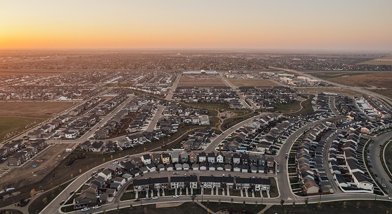 Bird’s eye view of a city and urban landscape featuring well-developed homes, organized streets, and a structured neighborhood layout