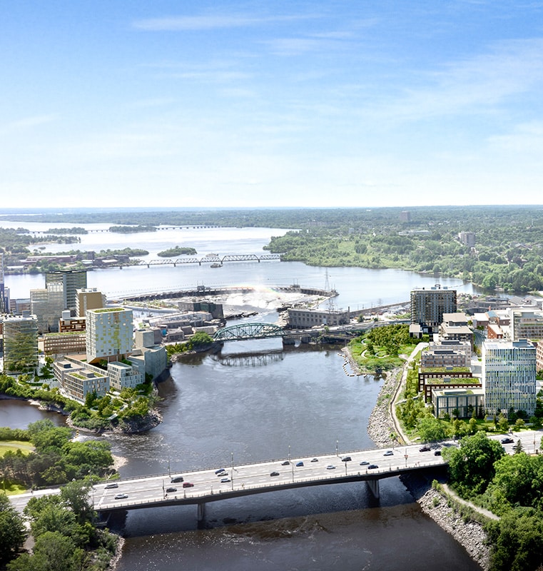 Aerial view of the Zibi district showing multiple bridges crossing a river, surrounded by high-rise and smaller buildings, greenery, and additional bodies of water in the background under a mostly clear sky